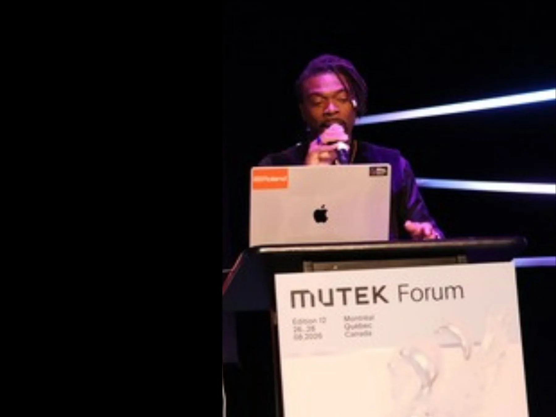 Dennison Blackett speaking at the MUTEK Forum podium