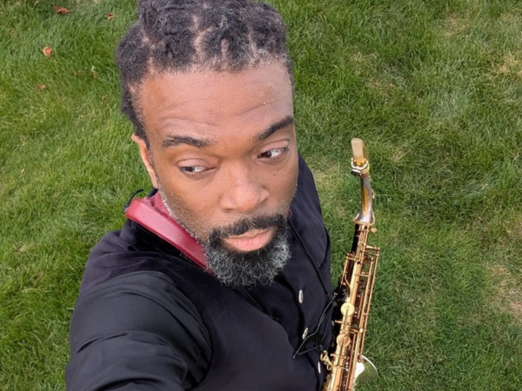 Dennison Blackett with soprano saxophone